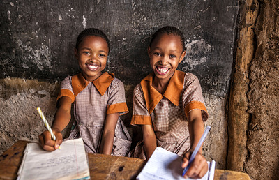 African little girls during their English class in orphanage. There is no light and electricity inside the classroom. Around 50-60 orphans live in this orphanage which is located near Nairobi.